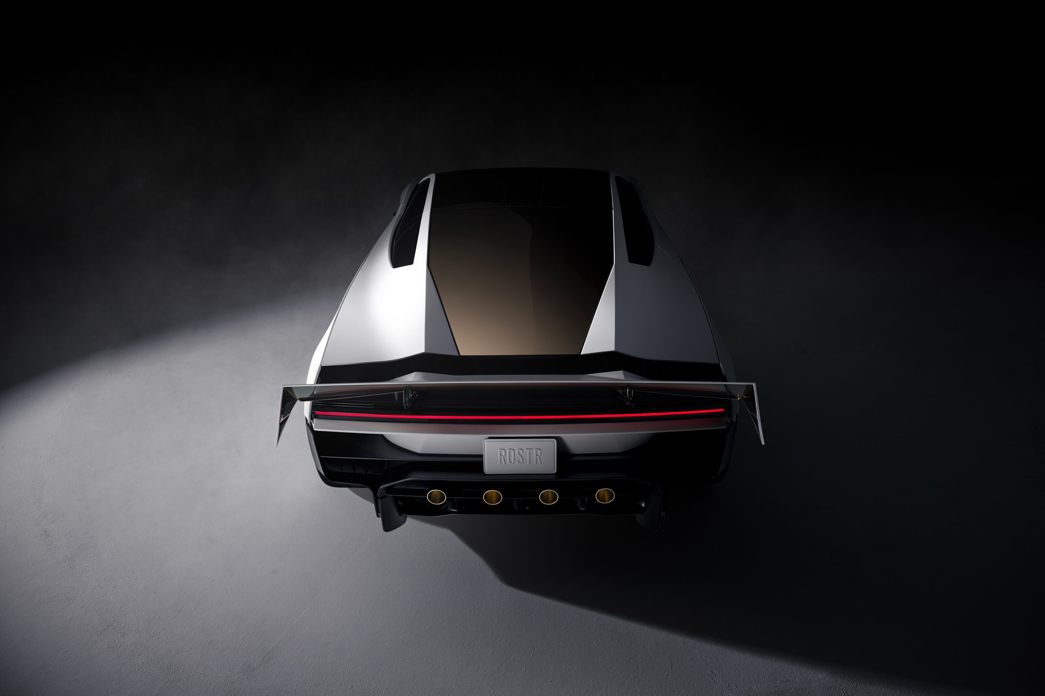 2026 Tesla Roadster, rear view with full-length taillight and wing